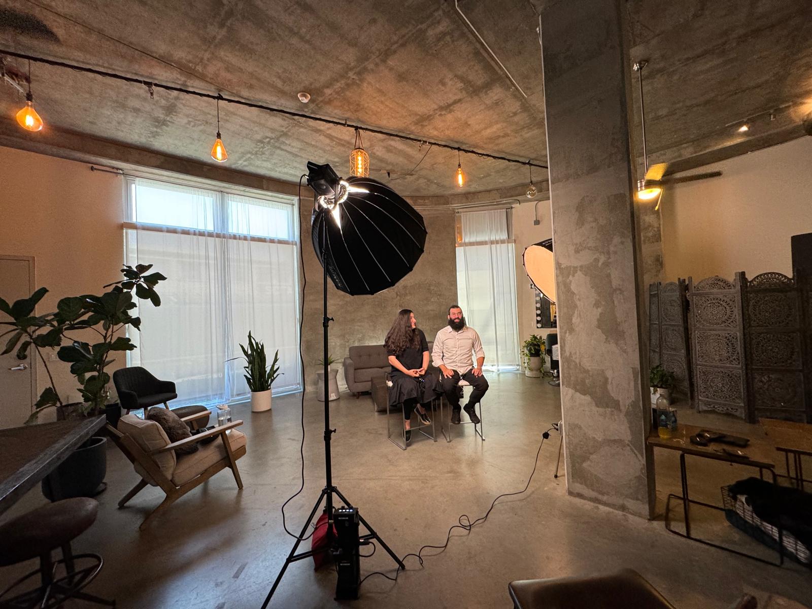 A family interview being filmed in a professional studio